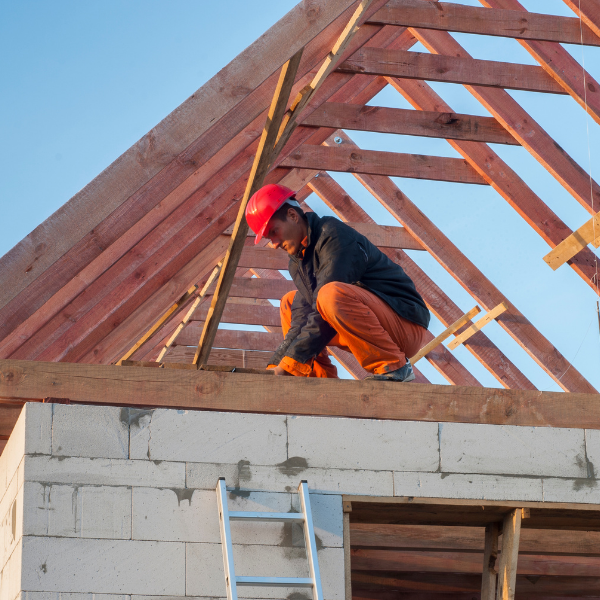 Roofing Contractor in Welland How to Get the Best Value For Your Money - a roofer working on the roof of a new build