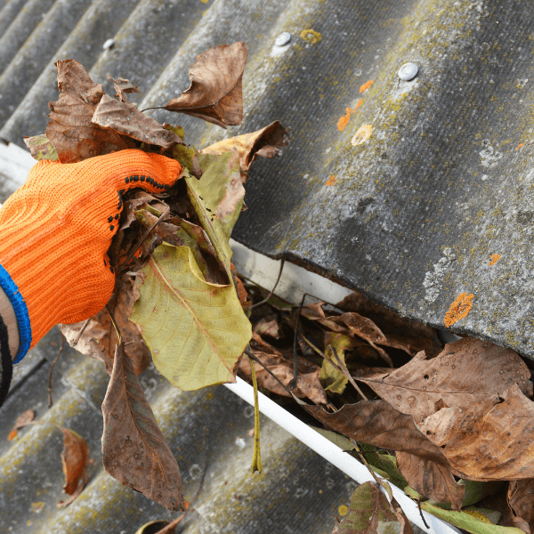 Welland roofing companies - How to Get The Most Out of Your Roofing or Siding Investment - cleaning out a dirty gutter