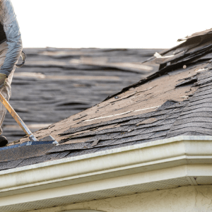 roofers welland - The Dos and Don'ts of Maintaining Your Roof - a roofer making repairs to a damaged shingled roof